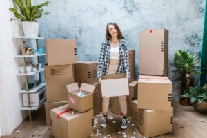 Worried Stressed Woman with Moving Boxes
