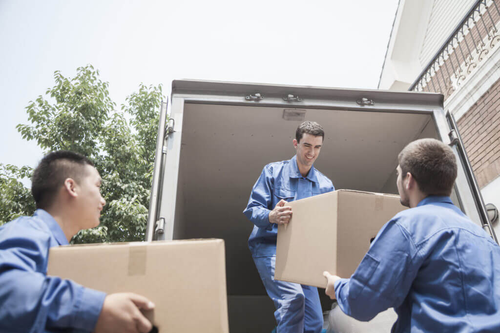 Men loading a container