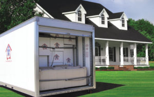 Mobile Attic Container in front of House Black Roof Optimized