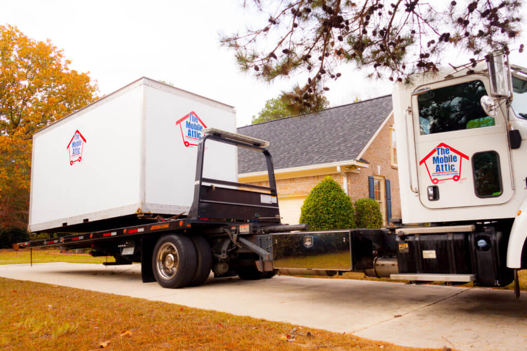 Mobile Attic Truck unloading container