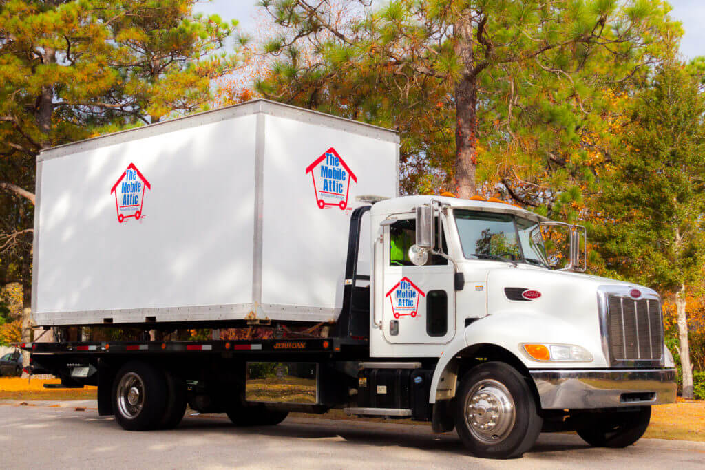 Mobile Attic Truck with green and orange trees Website Image