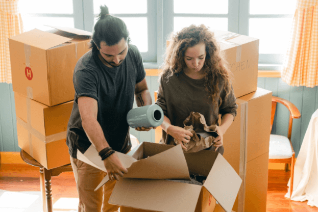 People Placing jugs into box MA Website Image