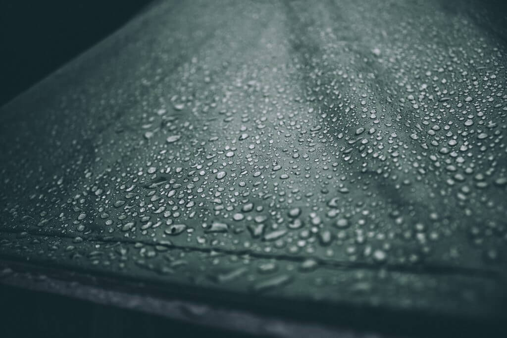 Raindrops on a blueish surface