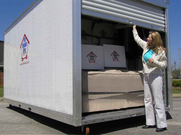 Woman Pulling down door of Mobile Attic Container Website Image