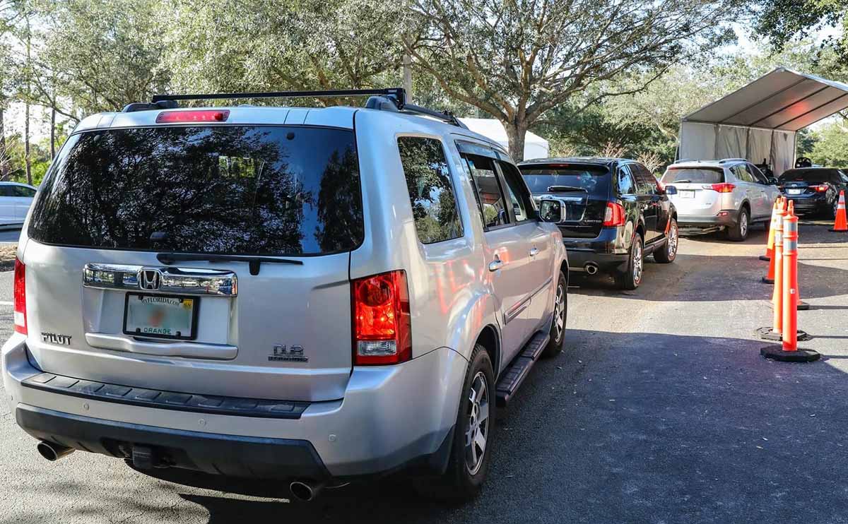 Cars in line for covid testing MA Website Image