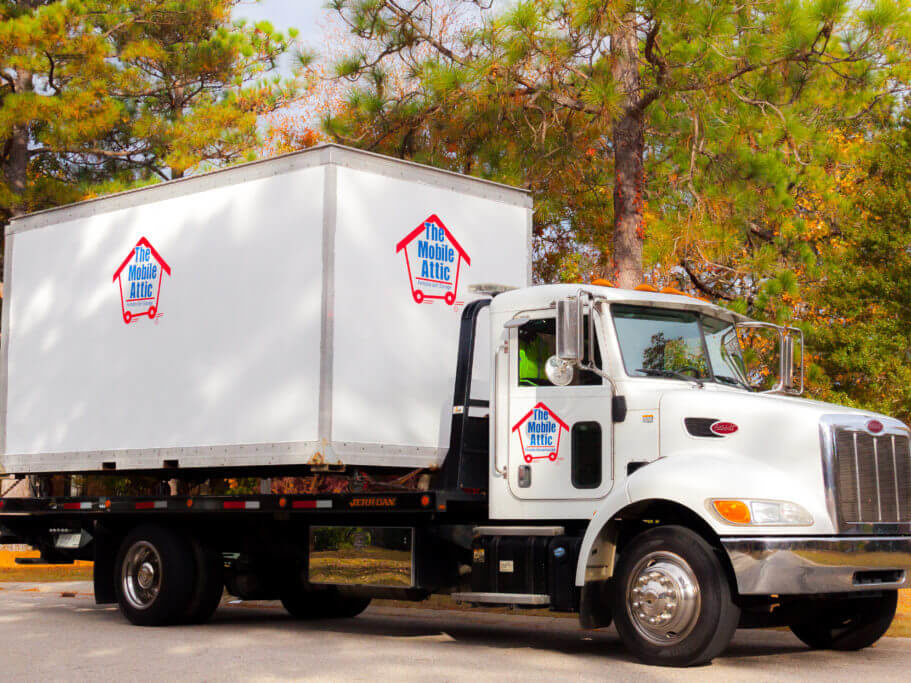 Mobile Attic Truck with green and orange trees Website Image Slight Crop