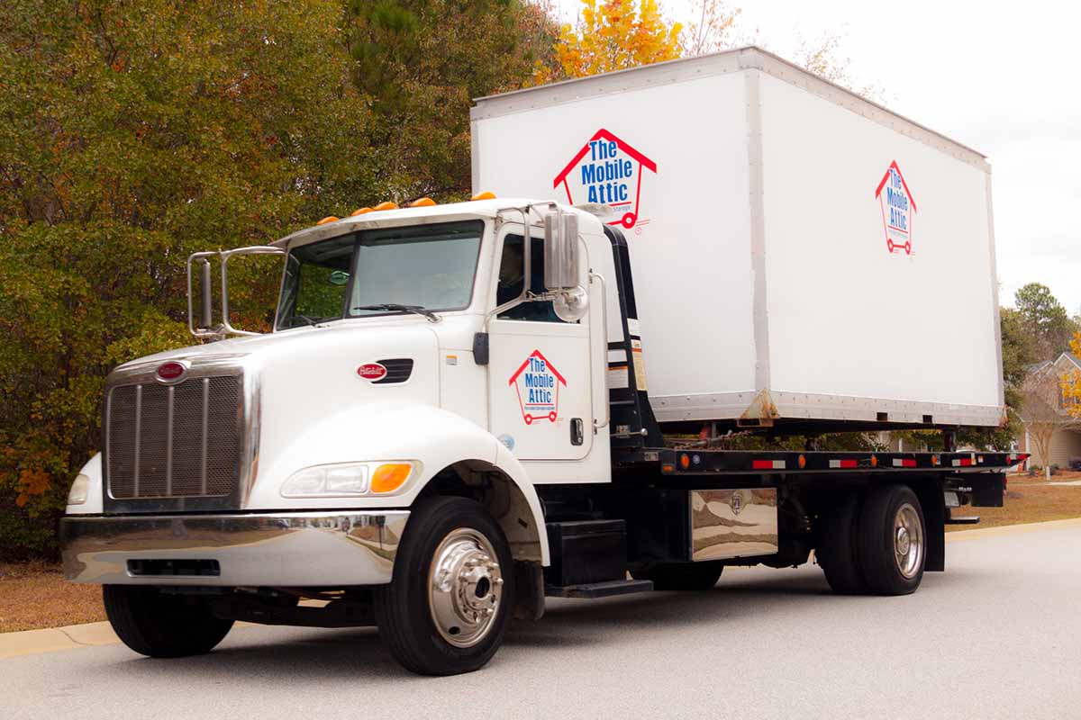 Mobile Attic Truck with Big Trailer at Lot