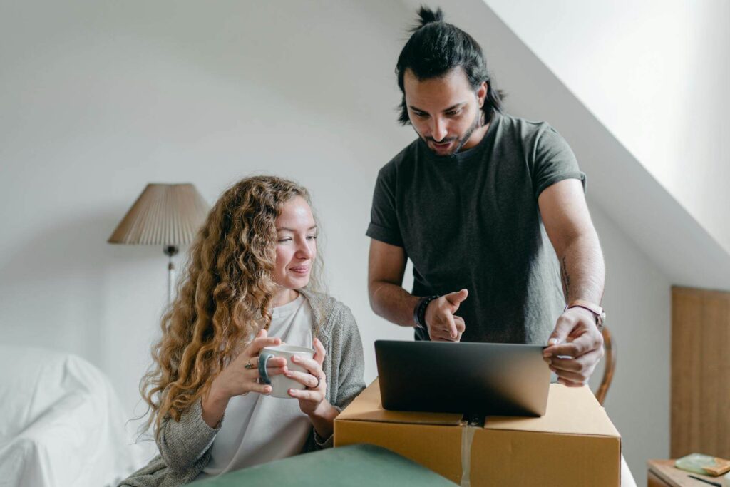 Move Out Moving Out Checklist Couple with Laptop and Boxes