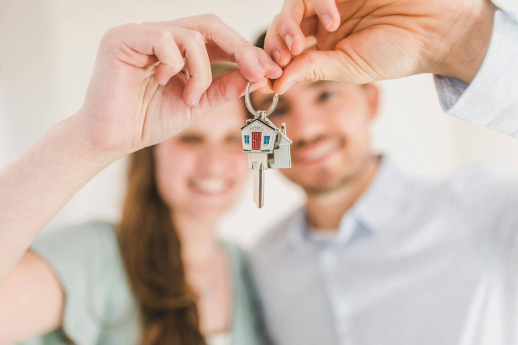 Happy Couple showing new House Key