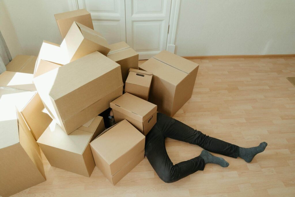 Lots of Heavy Packing Boxes on a person